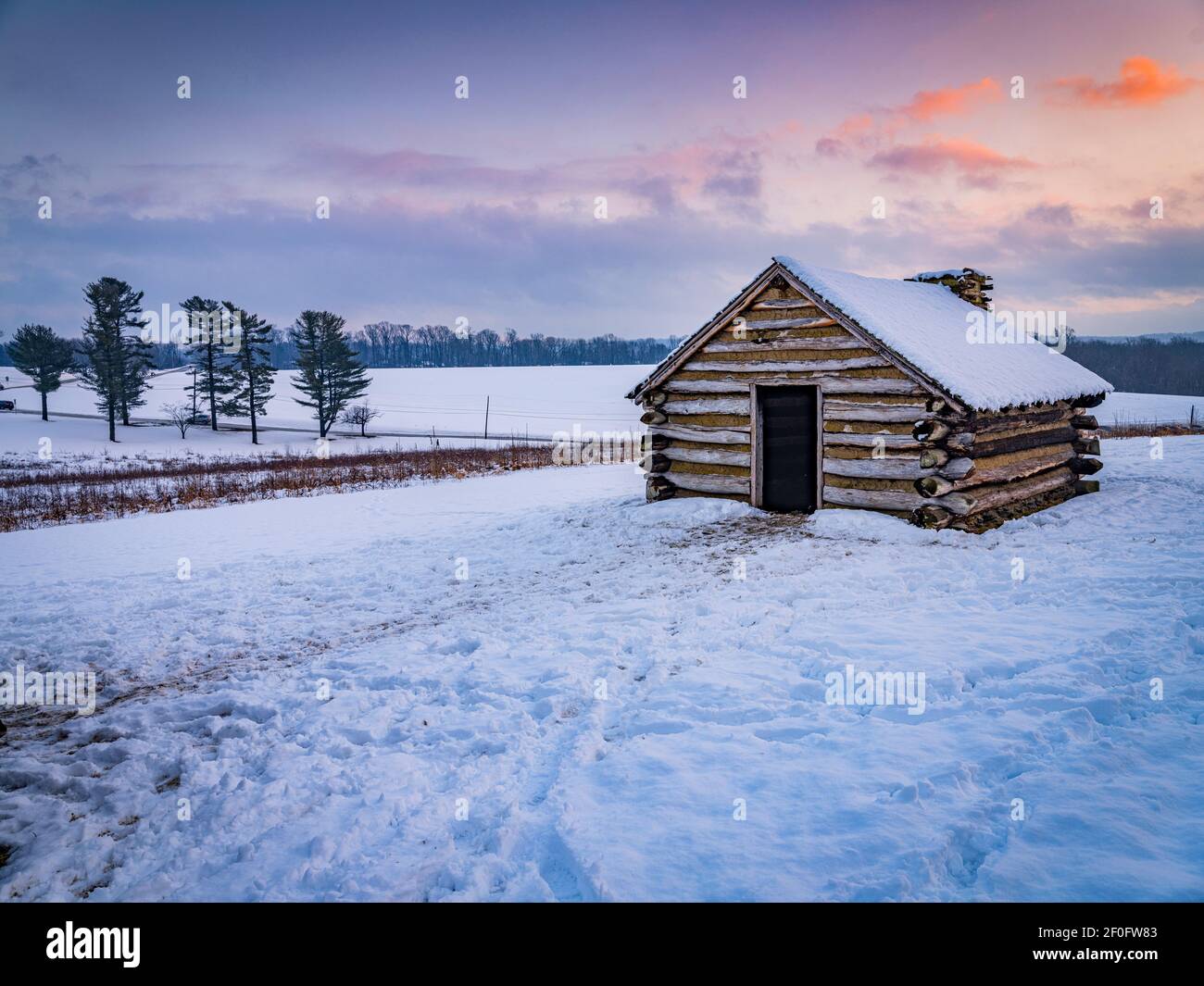 Log cabins in the winter snow, Valley Forge National Park Stock Photo