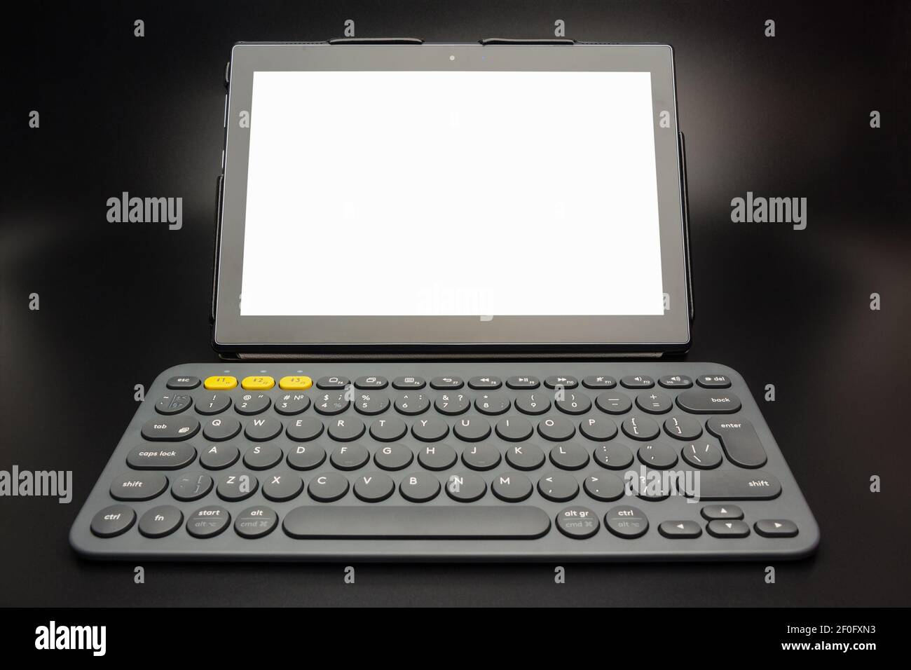 Tablet computer with white screen and small wireless keyboard Stock Photo