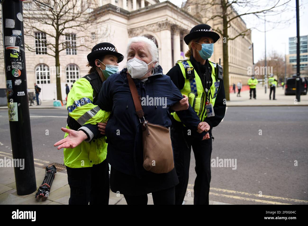 Police detain an NHS worker after breaking up a protest in Manchester, over the proposed 1% pay rise for NHS workers from the Government. Picture date: Sunday March 7, 2021. Stock Photo