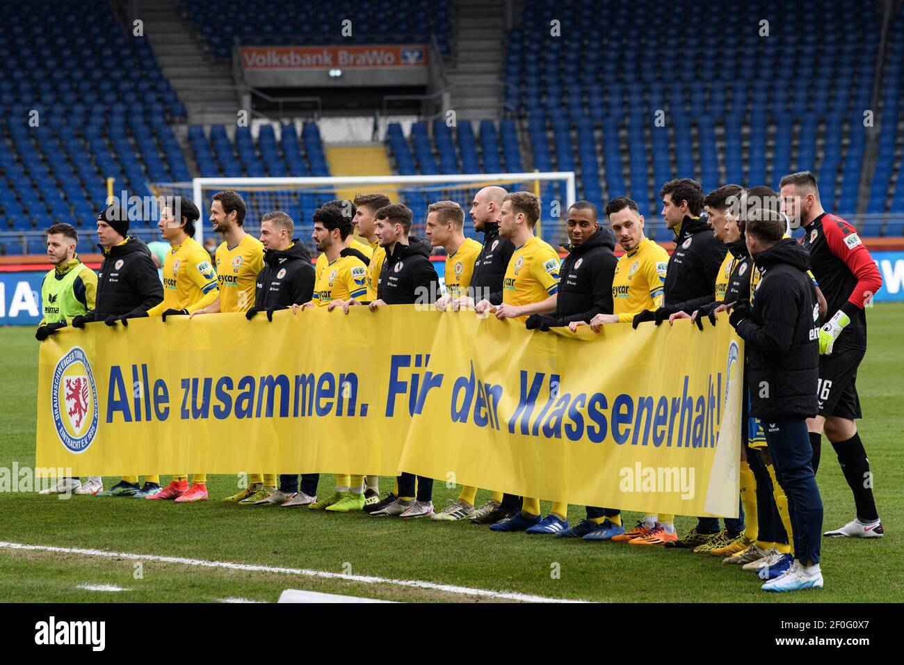 Brunswick, Germany. 07th Mar, 2021. Football: 2. Bundesliga, Eintracht  Braunschweig - SV Sandhausen, Matchday 24 at Eintracht-Stadion.  Braunschweig's players hold a banner at the start of the match with the  words "Alle