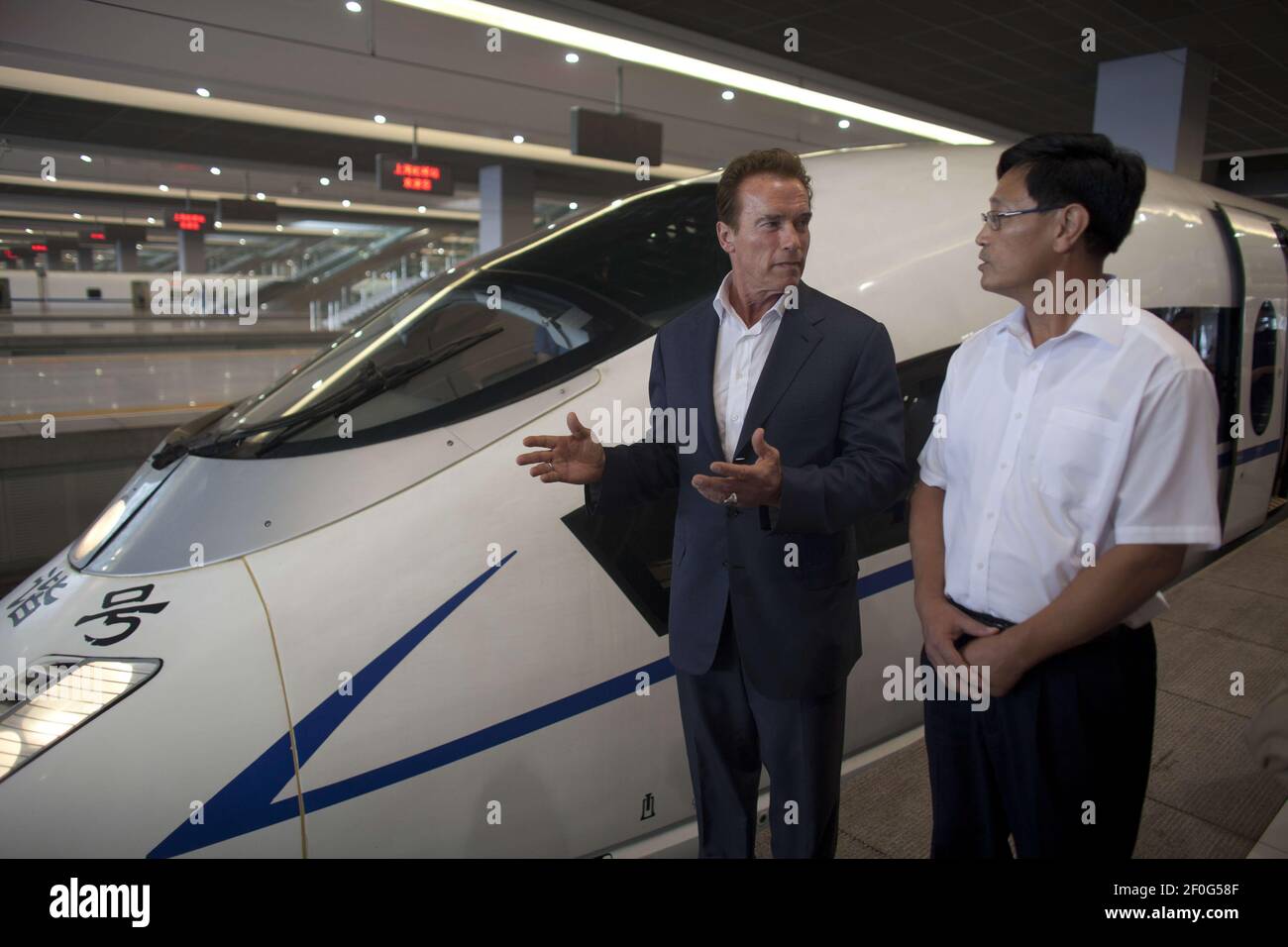 11 September 2010- Shangahi, China- Governor Arnold Schwarzenegger discusses with PeopleÃ•s Republic of China Ministry of Railways Vice Minister Lu Chunfang ChinaÃ•s high-speed rail system, the largest high-speed rail network in the world at Hongqiao Railway Station and Shanghai Railway Station in Shanghai, China. Photo Credit: Peter Grigsby/Office of the Governor/Sipa Press/arnoldchina.011/1009122049 Stock Photo