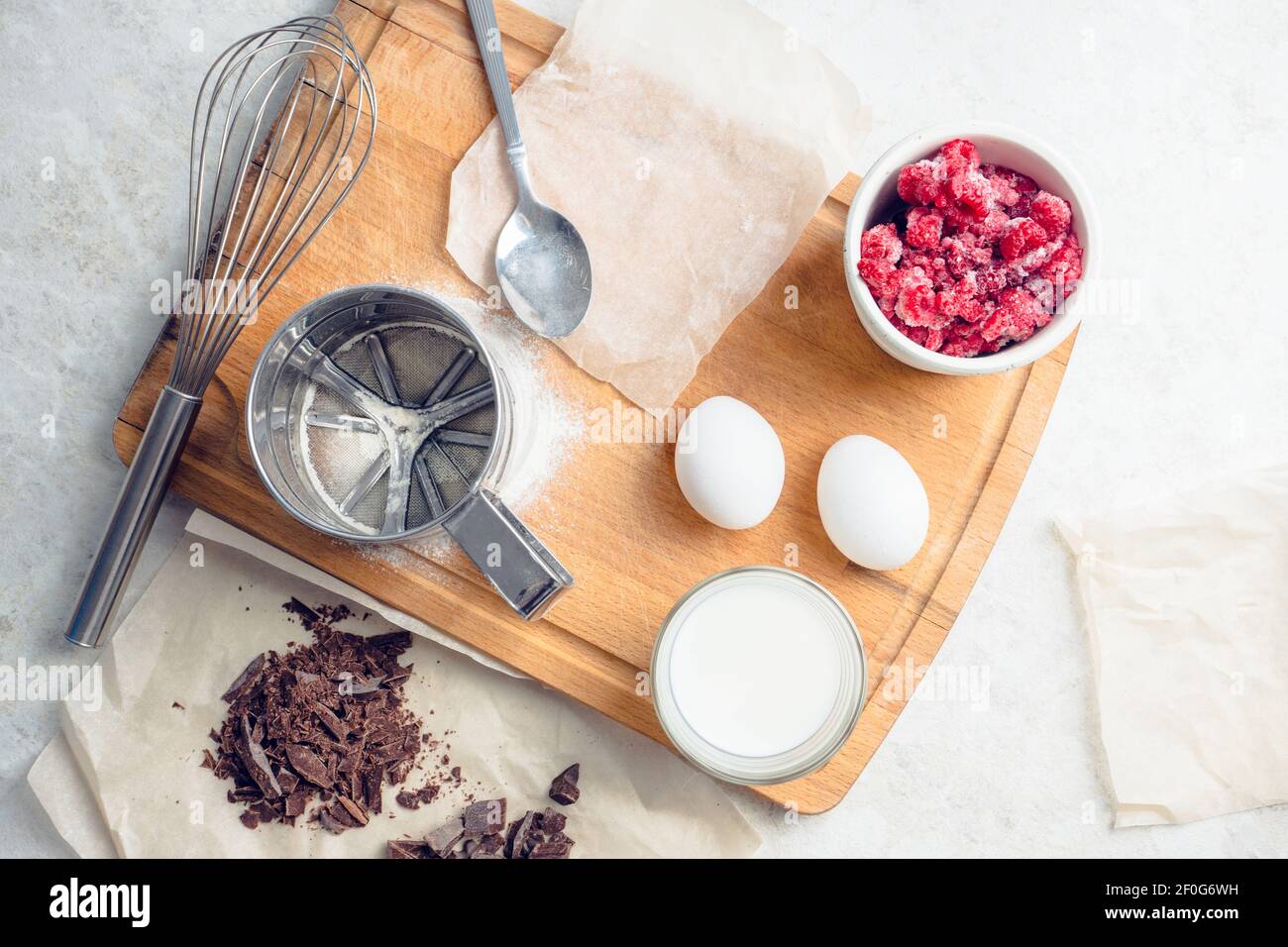 Ingredients for baking muffins on the kitchen table. Selective focus. Stock Photo
