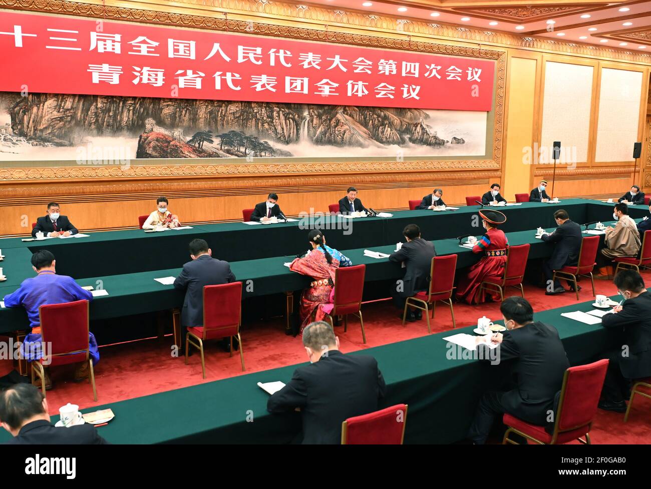 Beijing, China. 7th Mar, 2021. Chinese President Xi Jinping, also general secretary of the Communist Party of China Central Committee and chairman of the Central Military Commission, takes part in a deliberation with lawmakers from Qinghai Province, at the fourth session of the 13th National People's Congress in Beijing, capital of China, March 7, 2021. Credit: Li Tao/Xinhua/Alamy Live News Stock Photo