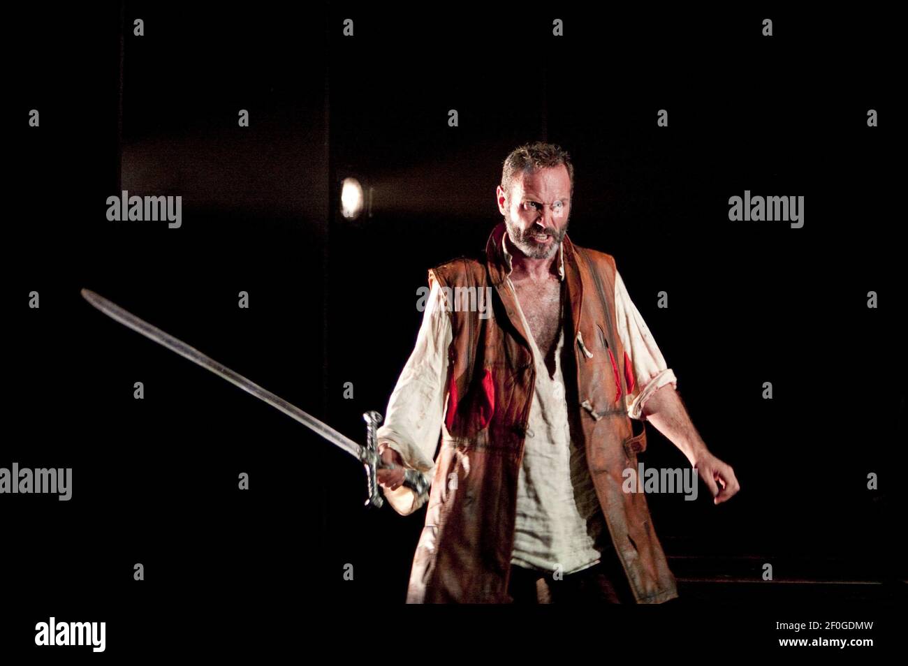 Andrew Rees (Siegmund) with Nothung (magic sword) in DIE WALKURE by Wagner at Longborough Festival Opera, Gloucestershire, England  24/07/2010 conductor: Anthony Negus  design: Kjell Torriset  lighting: Guy Hoare  director: Alan Privett Stock Photo