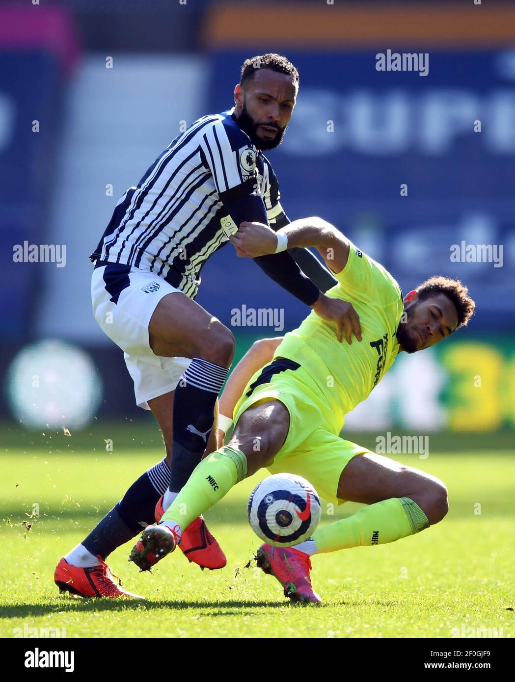 West Bromwich Albion's Kyle Bartley (left) and Newcastle United's Joelinton battle for the ball during the Premier League match at The Hawthorns, West Bromwich. Picture date: Sunday March 7, 2021. Stock Photo