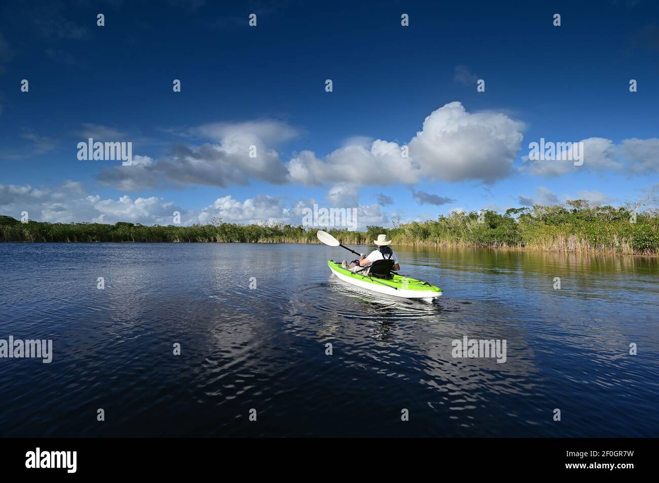 Active senior kayaking on Nine Mike Pond in Everglades National Park, Florida. Stock Photo