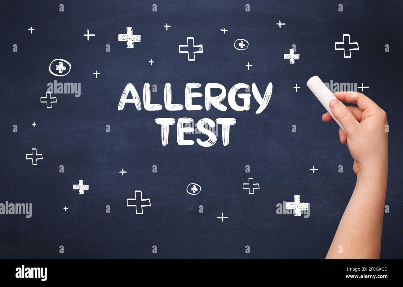 Hand drawing ALLERGY TEST inscription with white chalk on blackboard, medical concept Stock