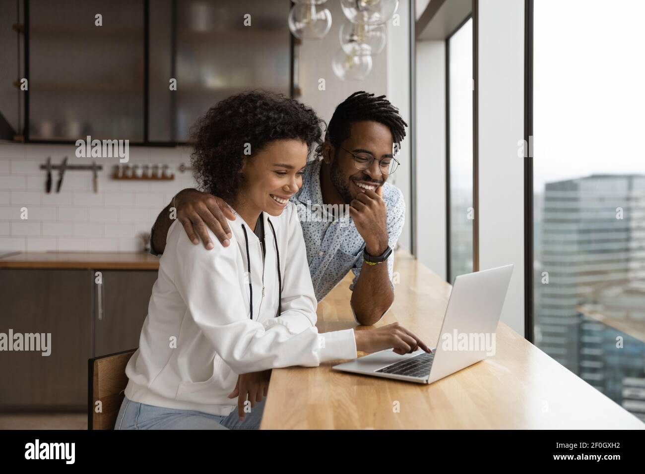 African american couple using laptop hi-res stock photography and ...