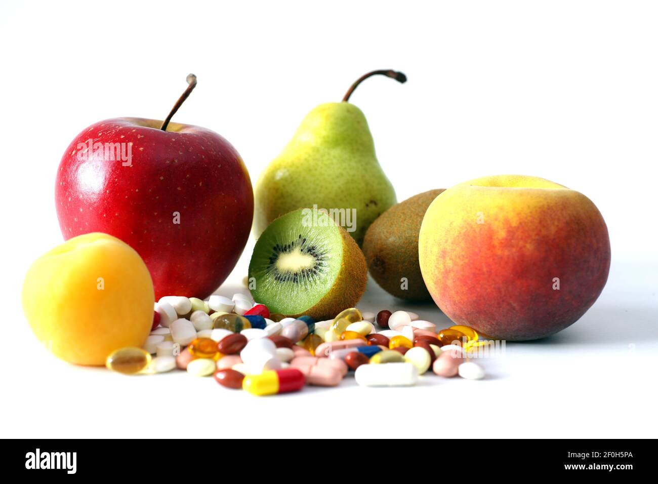 Vitamin pills capsules and fruit varieties healthy food good for immune