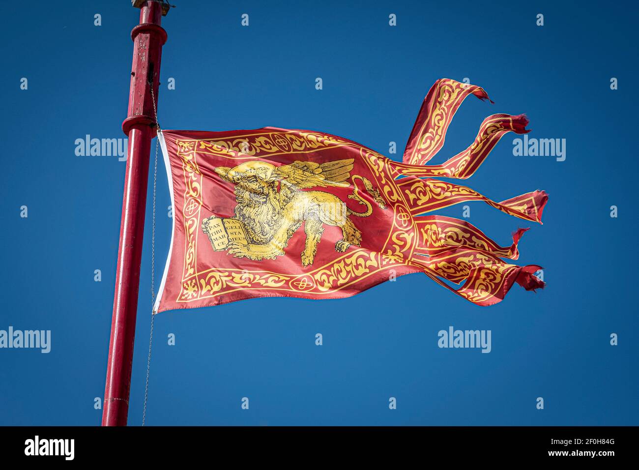 Venice, Italy. The flag or Standard of Saint Mark flying in Venice Stock Photo