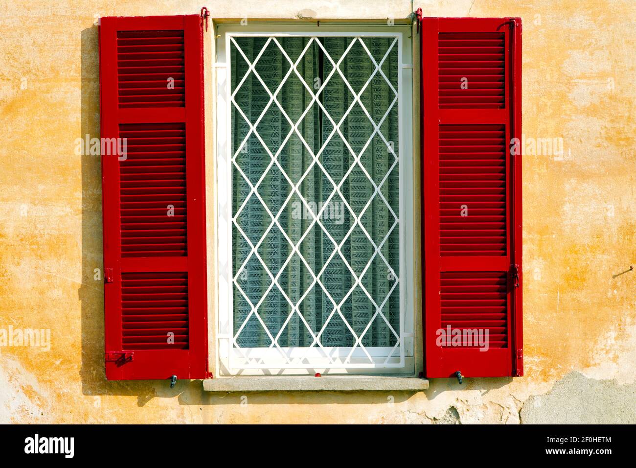 Red window  varano borghi  italy   abstract  sunny day  tent grate Stock Photo