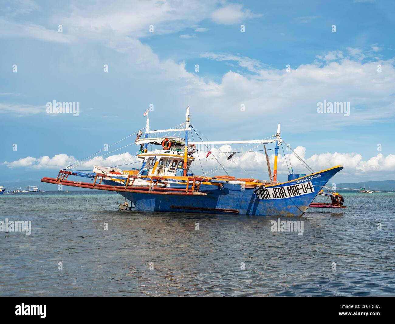 Traditional fishing boat with outriggers in Tinoto, a fishing village in Maasim, Sarangani