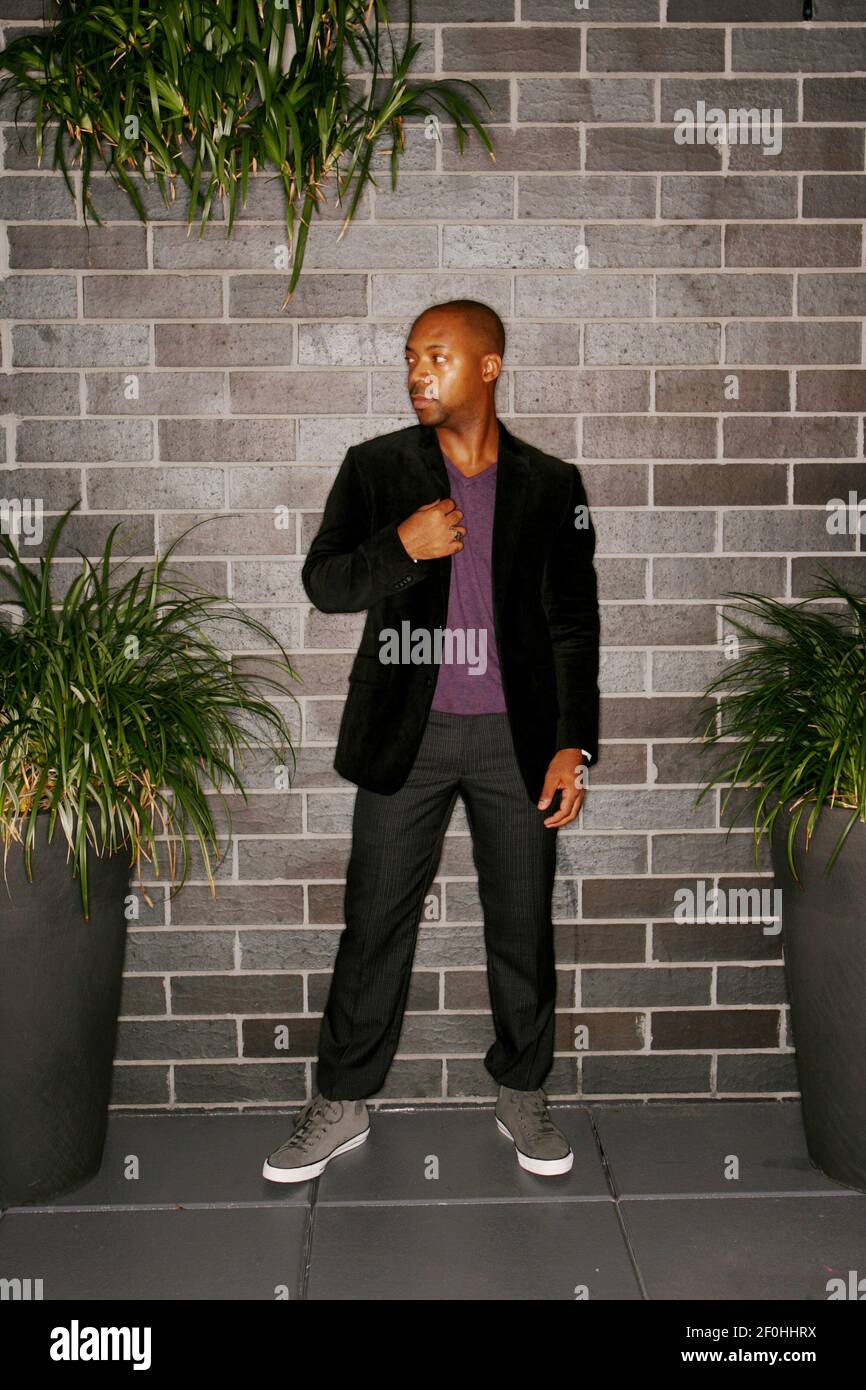 Byron has on a Merona purple v-neck sweater from Target; Banana Republic  Heritage collection dark charcoal wool back stitch pant flat front.  Converse charcoal brushed leather high top at SRI. (Photo by