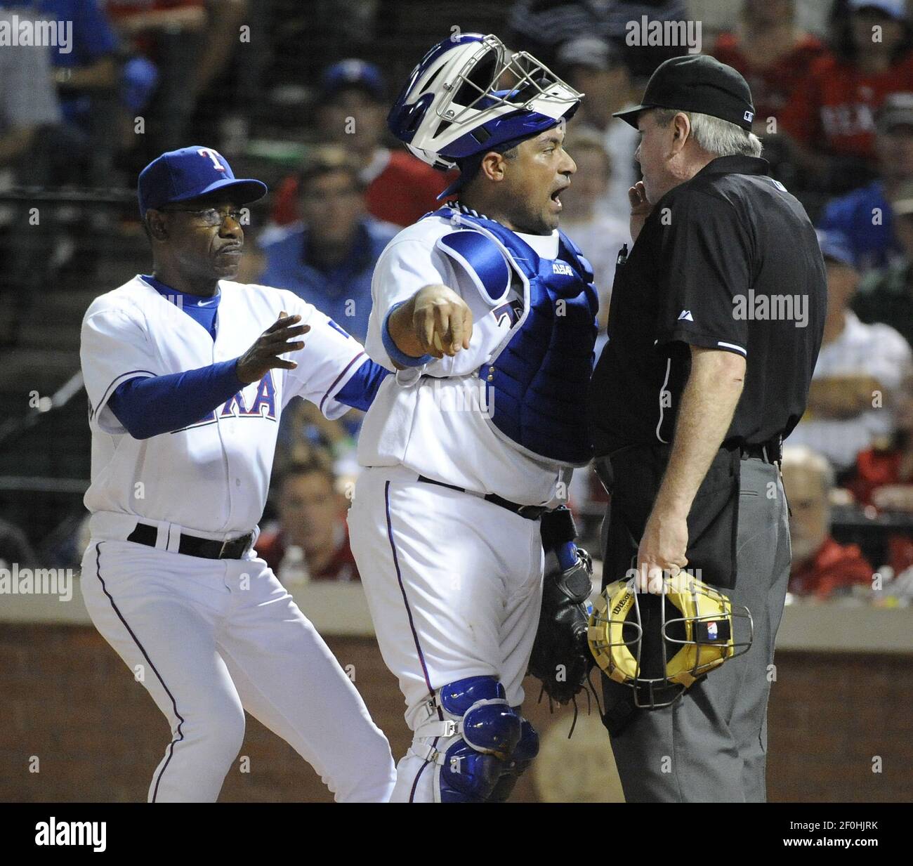 Texas Rangers Manager Ron Washington Left Goes To The Aid Of Catcher Bengie Molina With Umpire Brian Gorman Right On A Wild Pitch Play In The Fifth Inning Against The New York Texas Rangers Manager Ron Washington Left Goes To The Aid Of Catcher Bengie Molina With Umpire Brian Gorman Right On A Wild Pitch Play In The Fifth Inning Against The New York