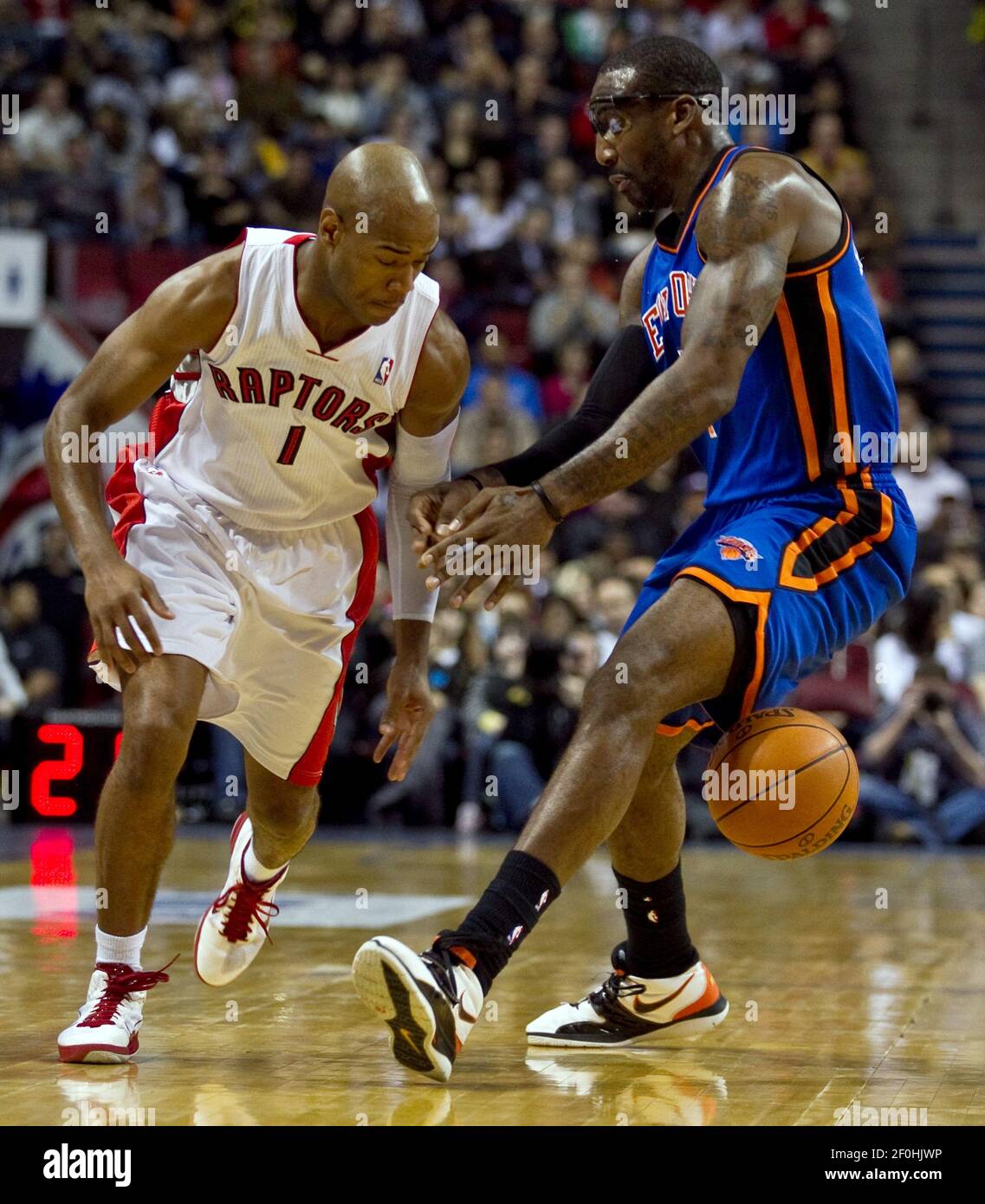 Toronto Raptors point guard Jarrett Jack (1) looses the ball between the  legs of New York Knicks power forward Amare Stoudemire (1) during the first  half of a preseason game at the