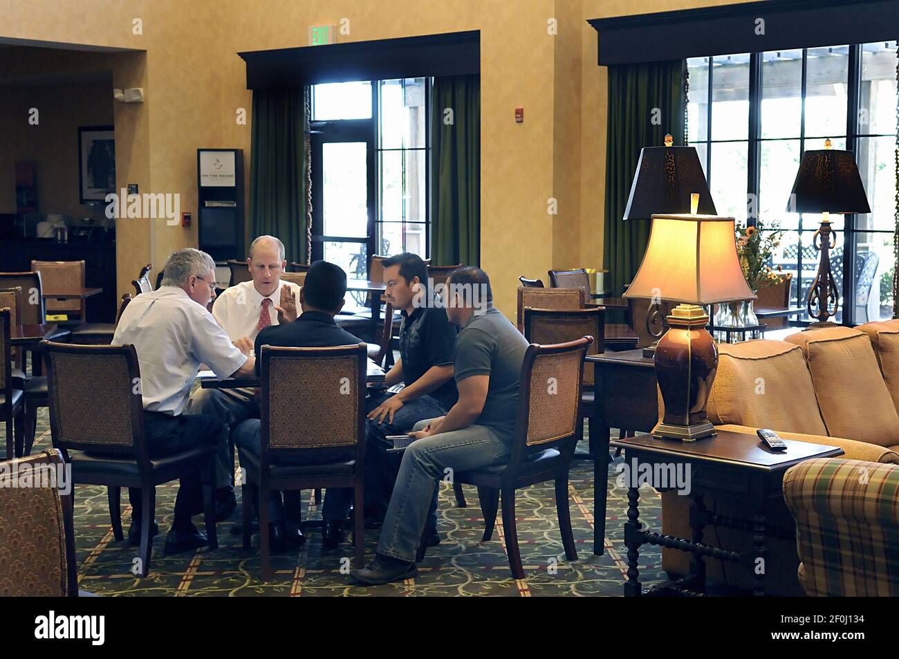 Sonny Weeks, second from left, who works for Iron Horse Auction Co