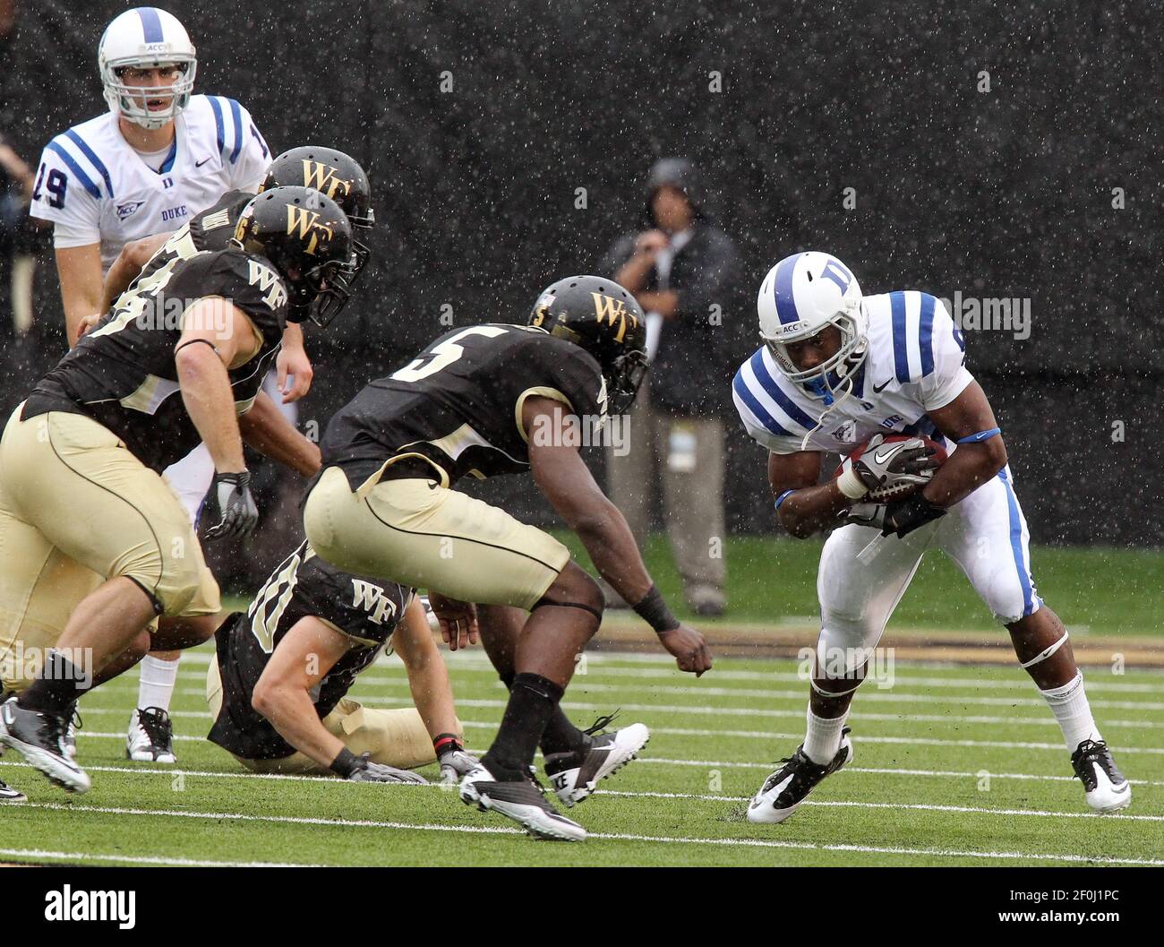 Duke quarterback Sean Renfree, left, watches as running back Josh Snead ...