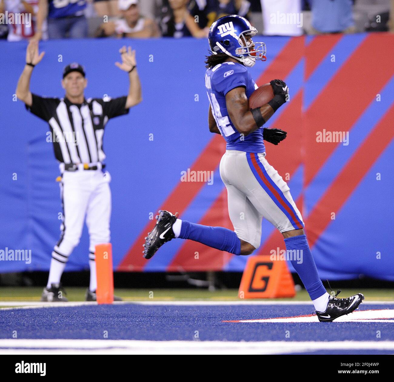 Duke Calhoun of the New York Giants strides into the end zone with the ...
