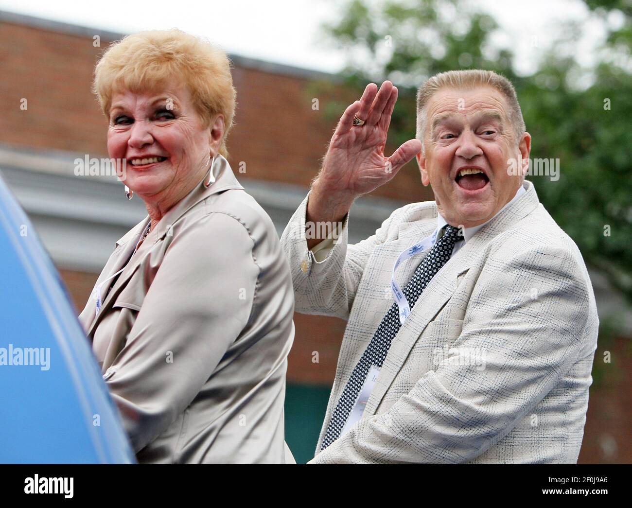 Former St. Louis Cardinals manager and 2010 Hall of Fame inductee Whitey  Herzog, right, and his wife, Mary Lou, wave to people they recognize along  the parade route during the Parade of