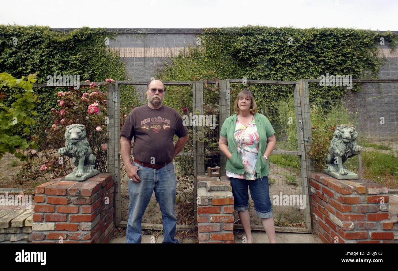 Bob, left, and Nancy Culbertson stand in their backyard where a sound