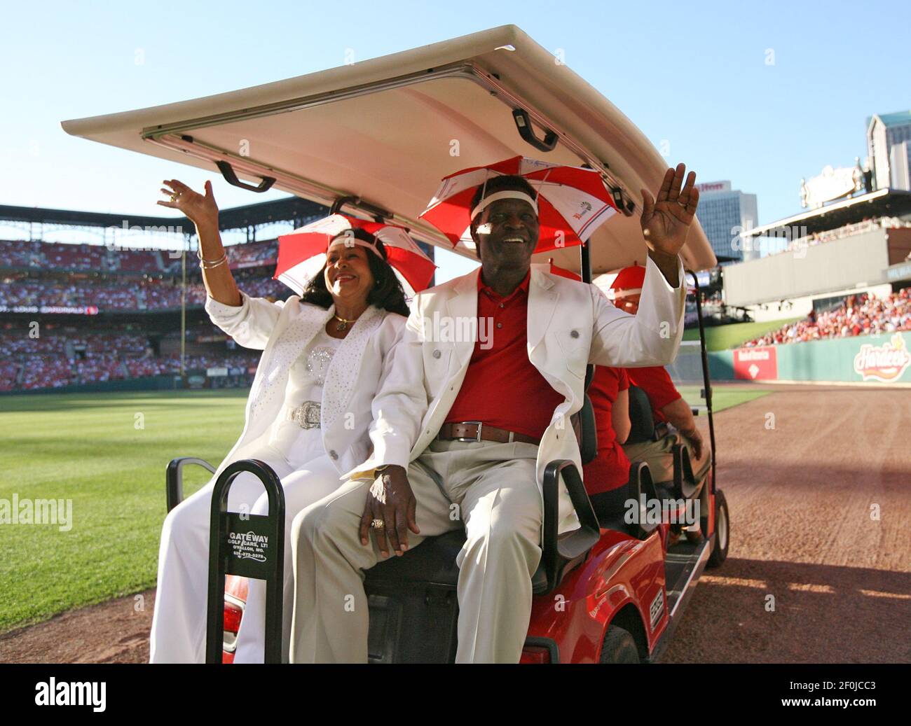 St. Louis Cardinals' Albert Pujols (L) and wife Diedra pose for a  photograph with National Baseball Hall of Fame member Lou Brock (R) and his  wife Jackie, before the annual Pujols Family