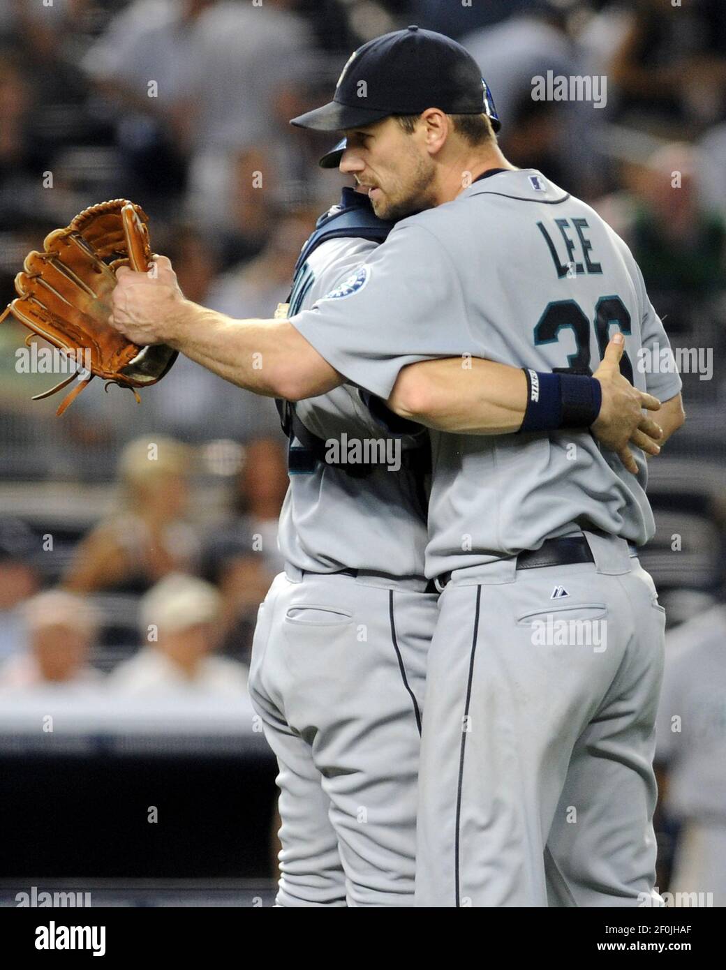 Seattle Mariners' Rob Johnson (32) congratulates pitcher Cliff Lee  (36), who retired the New York Yankees in the ninth inning, Tuesday, June  29, 2010 at Yankee Stadium in New York. Lee pitched