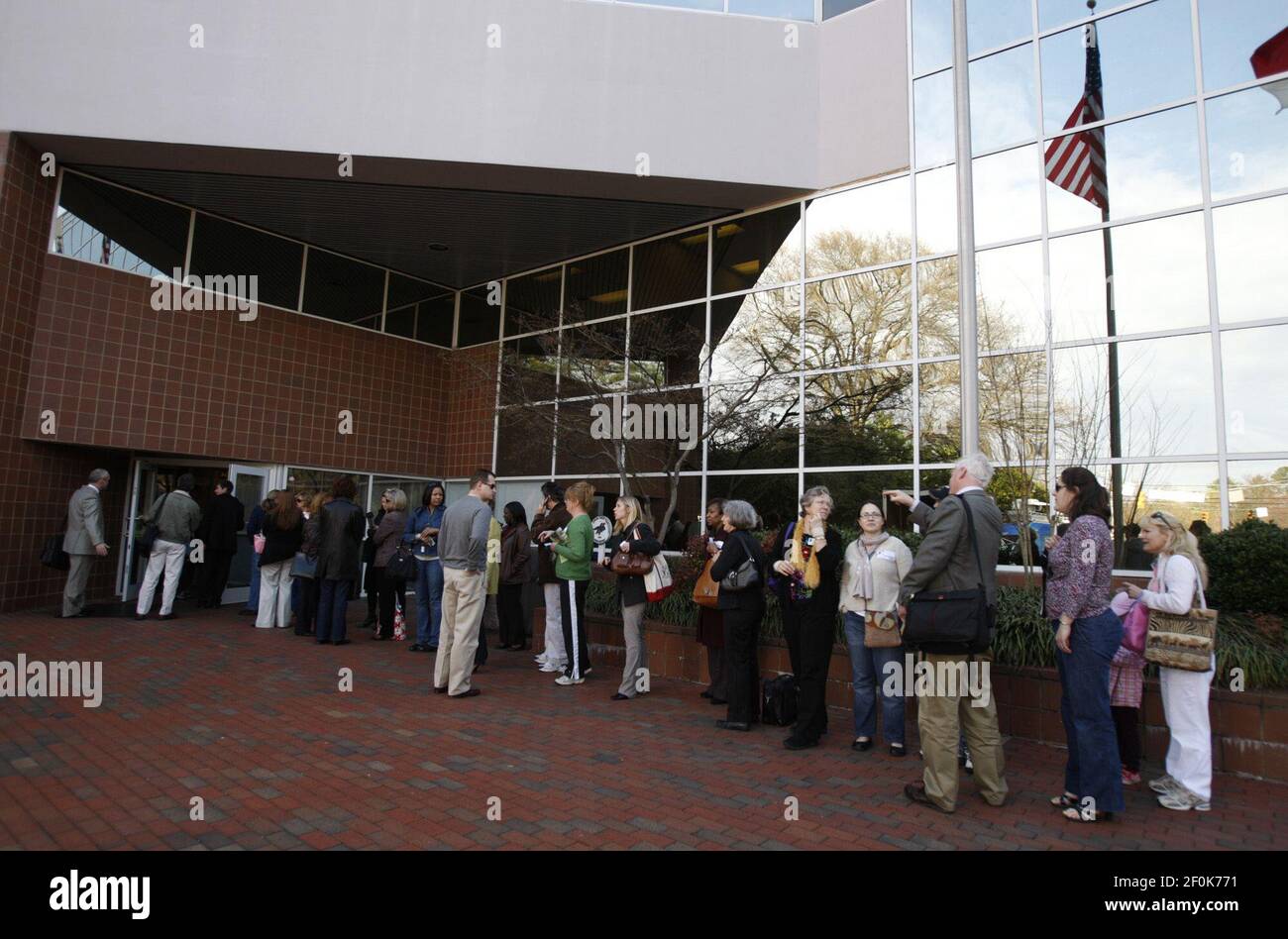 People line up outside the Wake County School Administration Building Tuesday, March 23, 2010 in Raleigh, North Carolina. During a tense marathon meeting, the Wake County school board voted to stop busing students for diversity, then cemented that action by taking the first steps toward a community-based system of student assignment. (Photo by Takaaki Iwabu/Raleigh News &amp; Observer/MCT/Sipa USA) Stock Photo