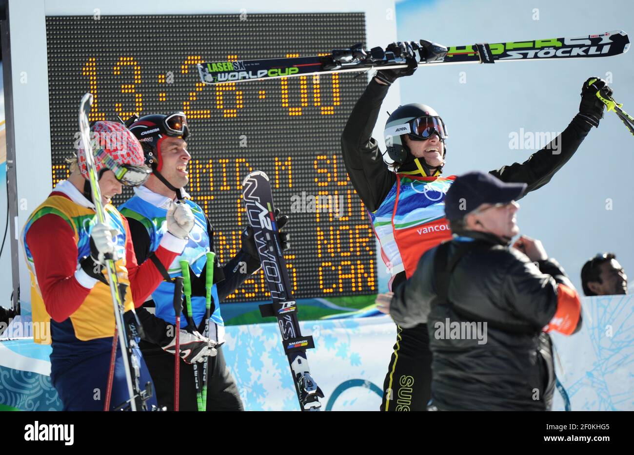 Michael Schmid from Switzerland (right) places first followed by Andreas  Matt (middle) from Austria and Audun Groenvold (left) from Norway in the  men&apos;s ski cross at the 2010 Olympic Winter Games in