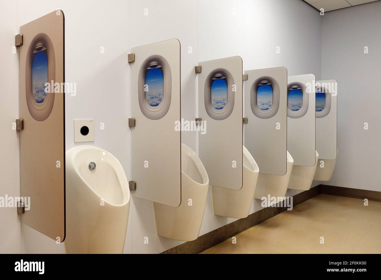 Row of Urinals in a Mens Pubic Restroom Stock Photo
