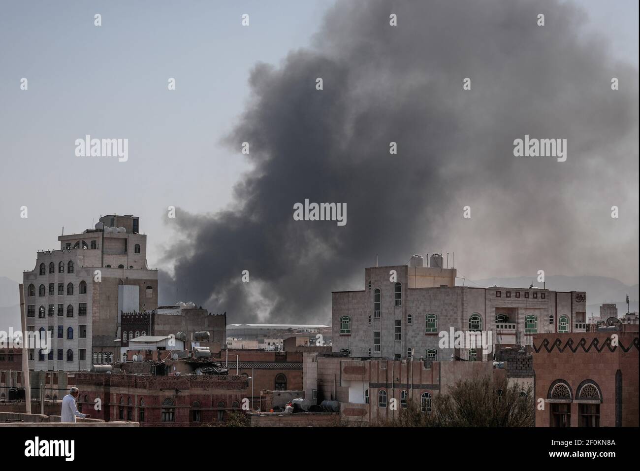 Sanaa, Yemen. 07th Mar, 2021. Heavy smoke billows from a military base