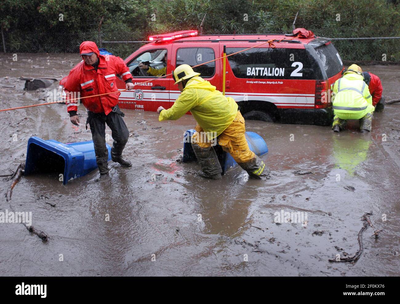 Los Angeles Fire Department Swift Water Rescue attach cables to free a