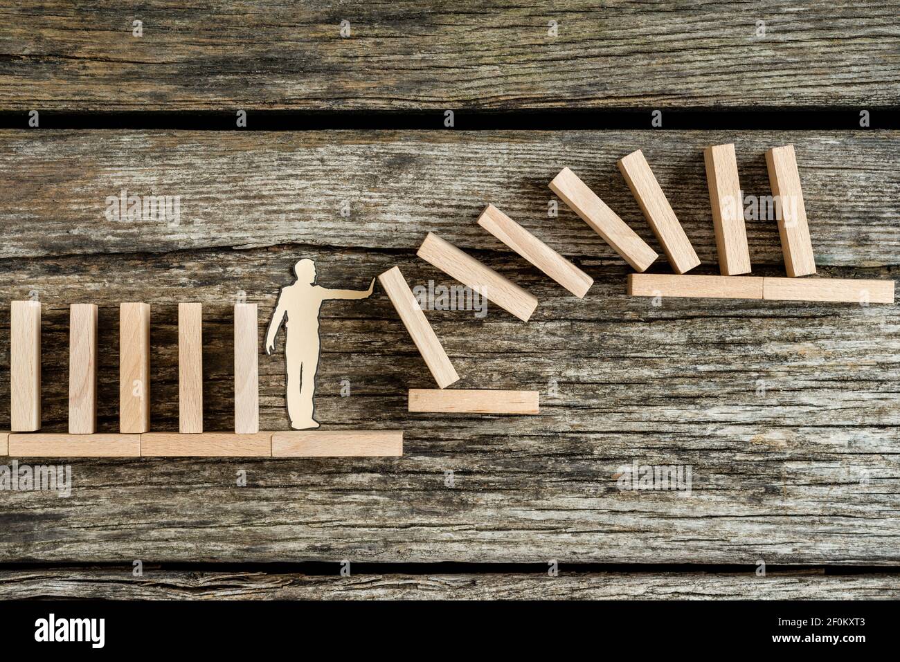 Silhouette Of A Paper Man Against The Risk Of A Domino Effect Conceptual Of Solving Problems Stock Photo Alamy