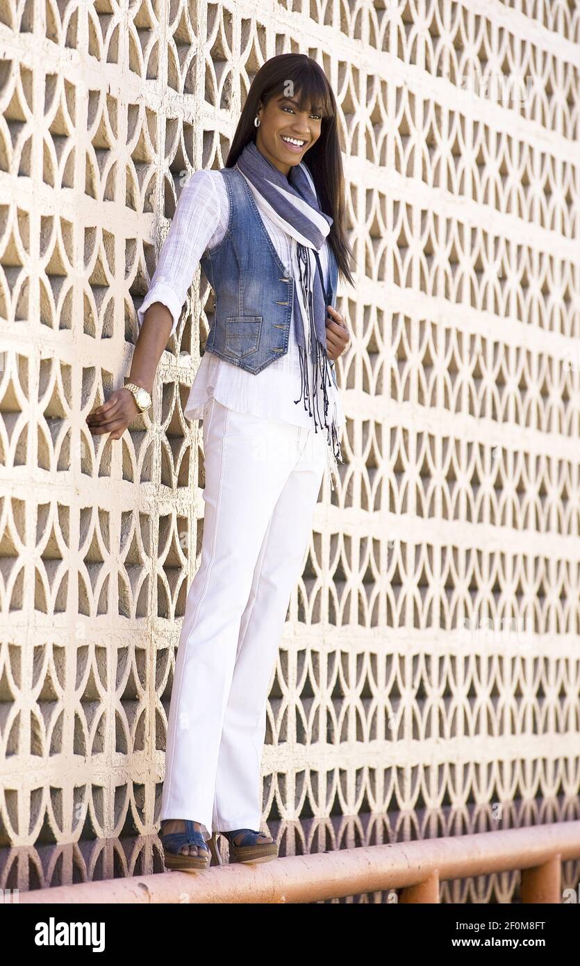 Scarf by Banana Republic ($69.50) and blouse is Rebecca Taylor ($215,  Neiman Marcus). Jean vest is from the Gap ($49.50). White jeans are Escada  ($550, Neiman Marcus). The watch is a gold