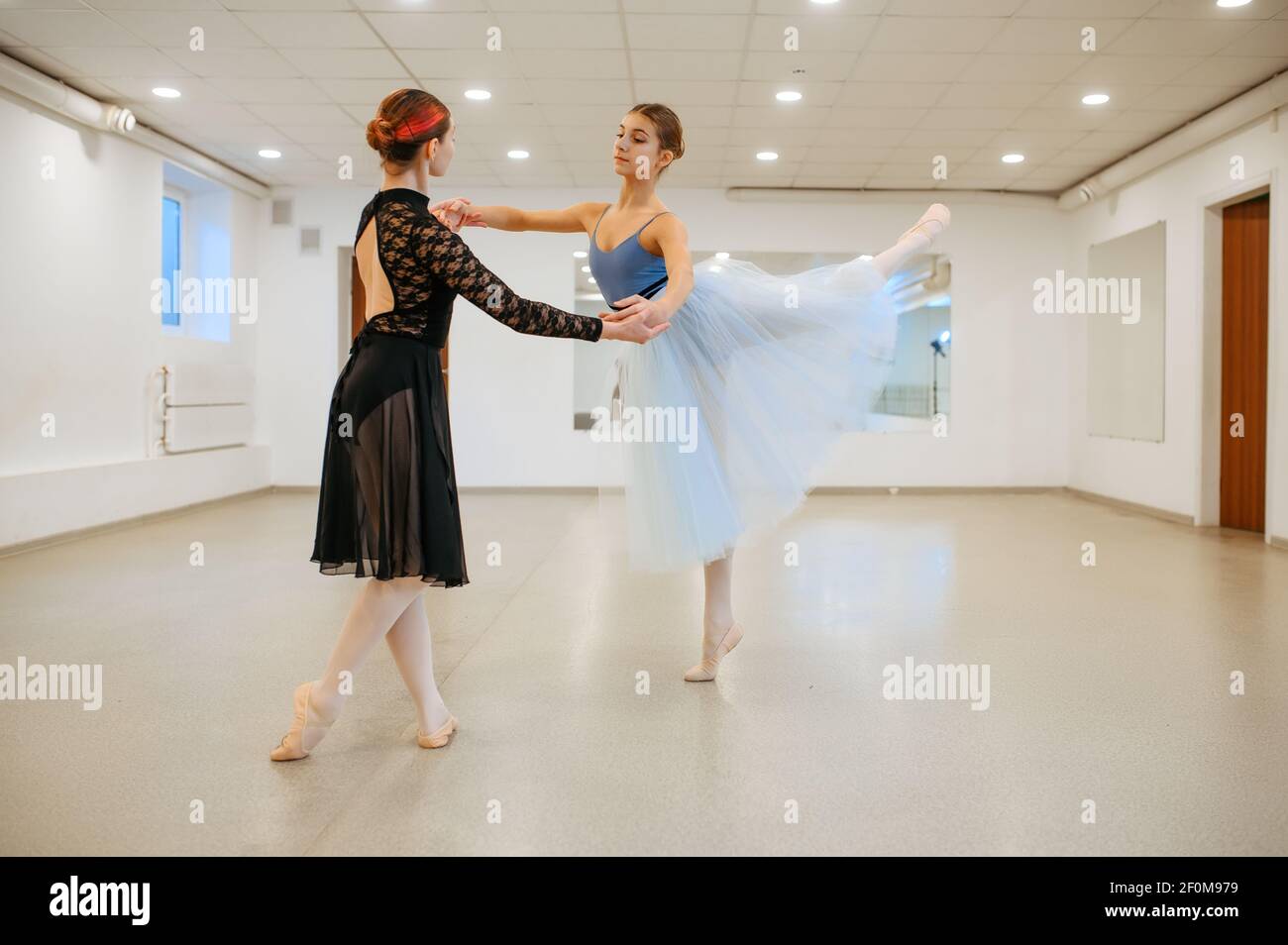 Choreographer works with young ballerina in class Stock Photo