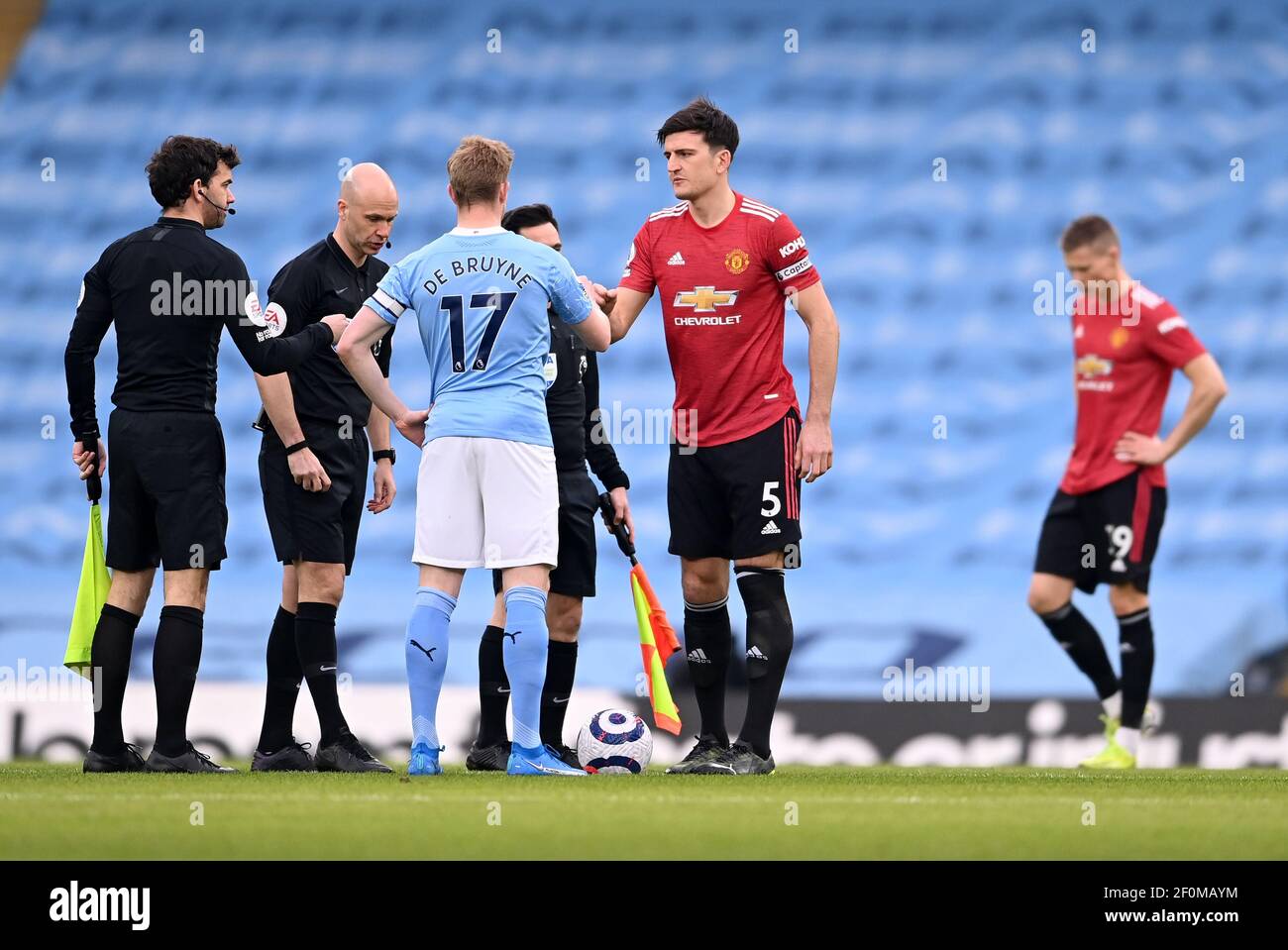 Manchester City's Kevin De Bruyne greets Manchester United's Harry Maguire before the Premier League match at the Etihad Stadium, Manchester. Picture date: Sunday March 7, 2021. Stock Photo