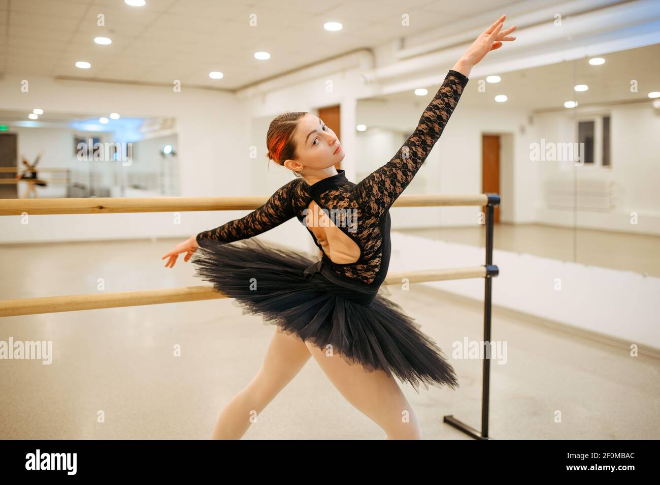 Choreographer poses at the barre, ballet school Stock Photo