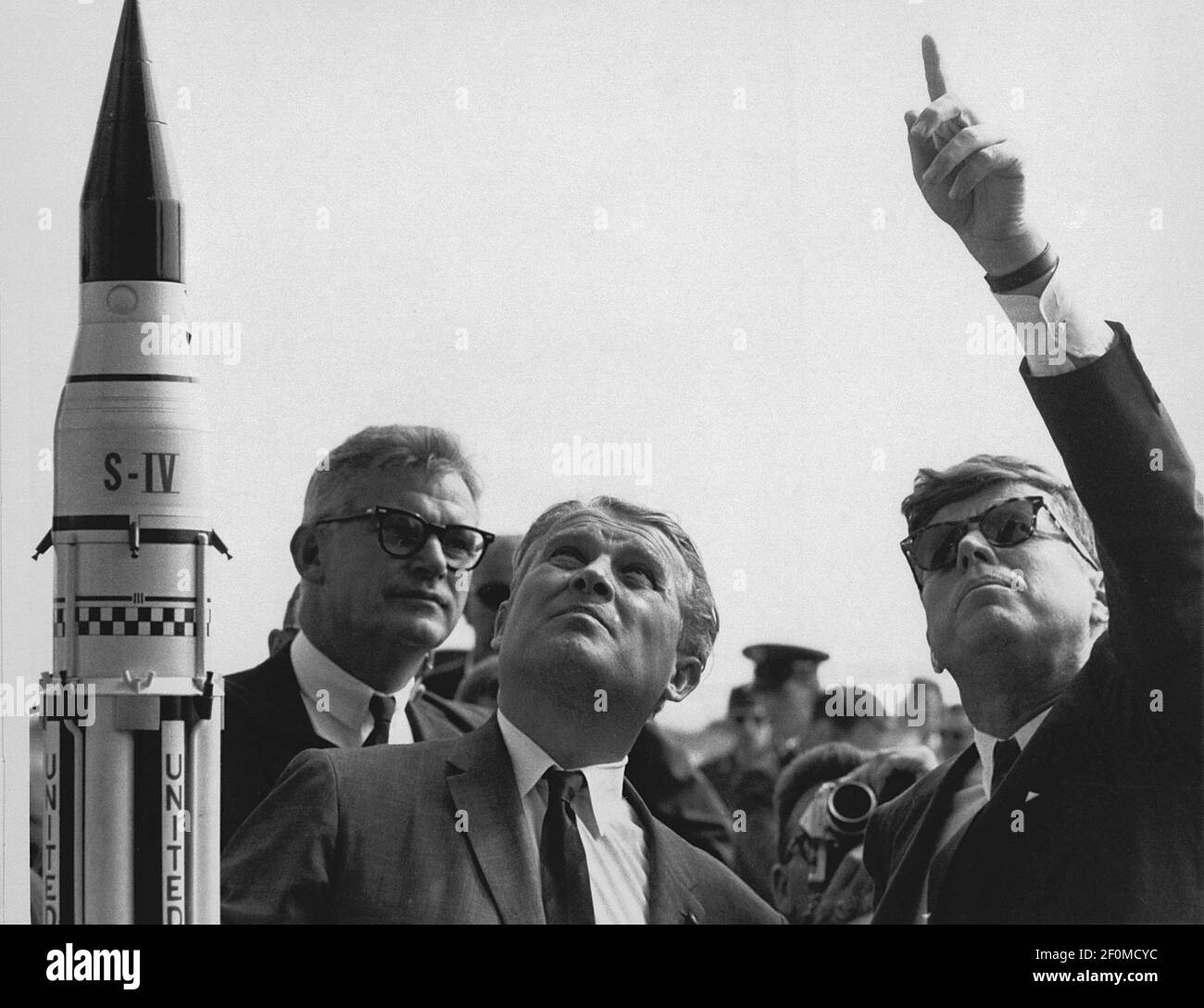 Marshall Space Flight Center (MSFC) Director, Doctor Wernher von Braun explains the Saturn Launch System to United States President John F. Kennedy at Cape Canaveral, Florida on November 16, 1963. National Aeronautics and Space Administration (NASA) Deputy Administrator Robert Seamans is to the left of von Braun. (Photo by NASA/CNP)*** Please Use Credit from Credit Field *** Stock Photo
