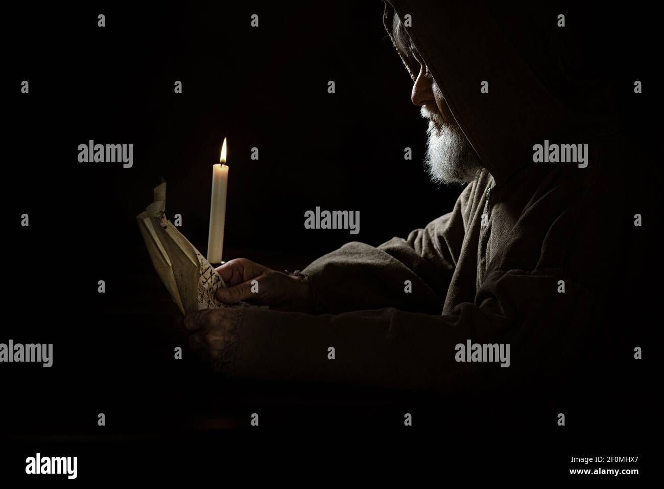 A Medieval monk reads a letter Stock Photo - Alamy