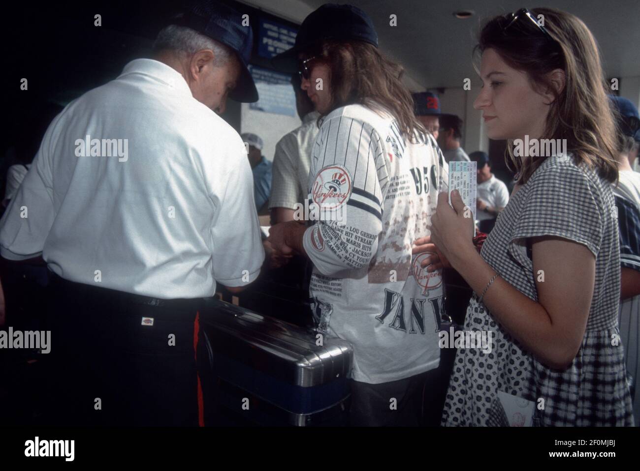 Yankees fans have their tickets taken upon entry to Yankee Stadium