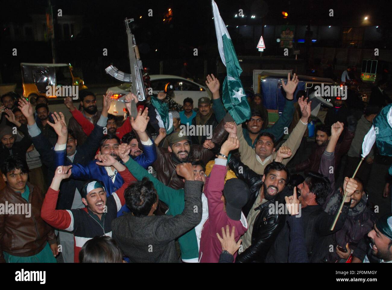 Citizens & civil society celebrates during a rally chant slogans in favor of Pakistan Army hold Pakistan flag after the Pakistan Air Force shot down two Indian jets for violating Pakistan’s airspace on Faisal Chowk Mall Road in Lahore on Febuary 27, 2019. Pakistan's military said Wednesday it shot down two Indian warplanes in the disputed region of Kashmir and captured two pilots, raising tensions between the nuclear-armed rivals to a level unseen in 20 years. (Photo by Rana Sajid Hussain / Pacific Press/Sipa USA) Stock Photo
