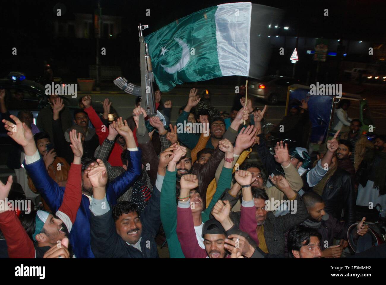 Citizens & civil society celebrates during a rally chant slogans in favor of Pakistan Army hold Pakistan flag after the Pakistan Air Force shot down two Indian jets for violating Pakistan’s airspace on Faisal Chowk Mall Road in Lahore on Febuary 27, 2019. Pakistan's military said Wednesday it shot down two Indian warplanes in the disputed region of Kashmir and captured two pilots, raising tensions between the nuclear-armed rivals to a level unseen in 20 years. (Photo by Rana Sajid Hussain / Pacific Press/Sipa USA) Stock Photo