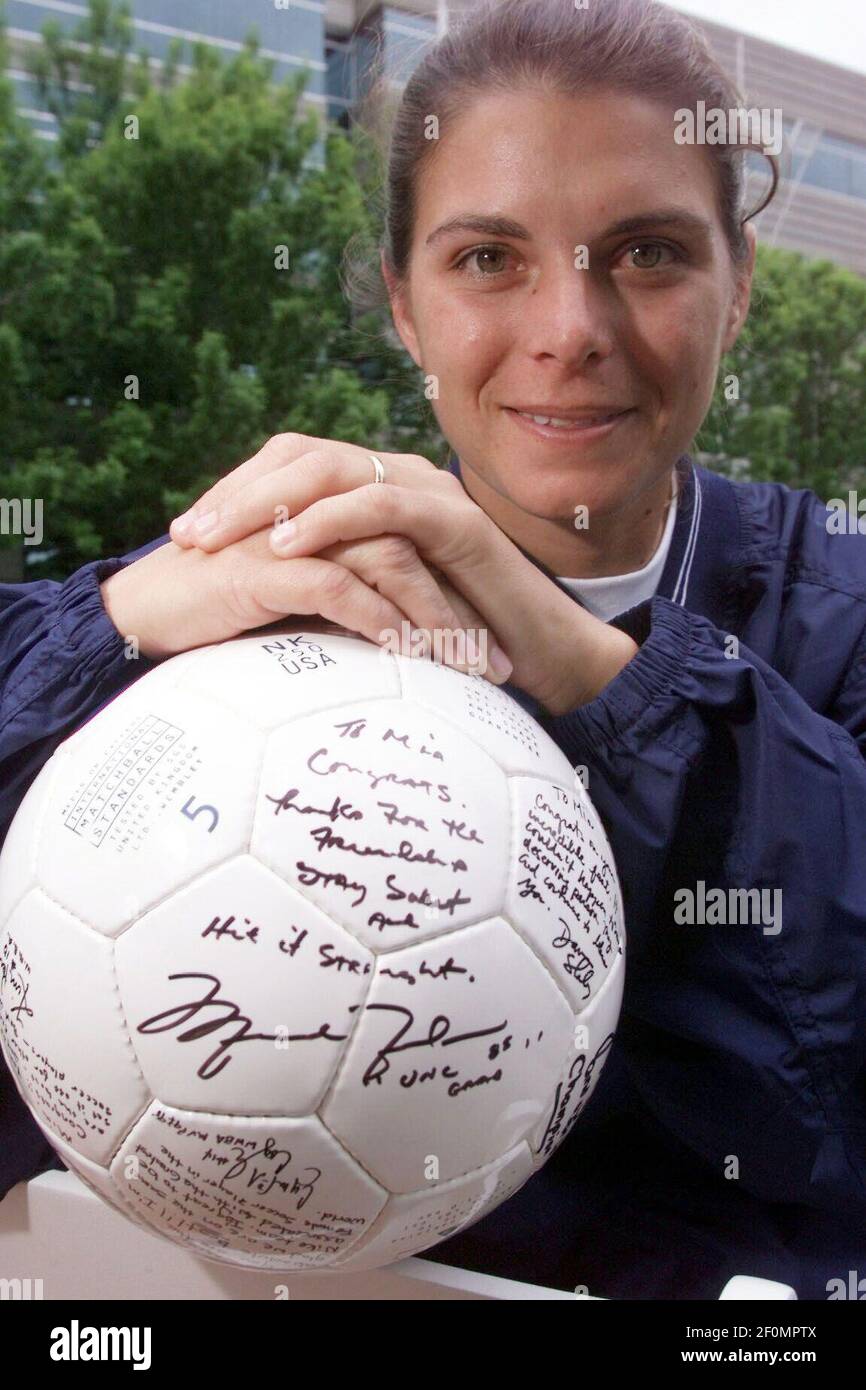 June 3, 1999; Beaverton, OR, USA; US soccer player Mia Hamm with a ball  autographed by her teammates to commemorate the dedication of a building in  her name at the Nike World
