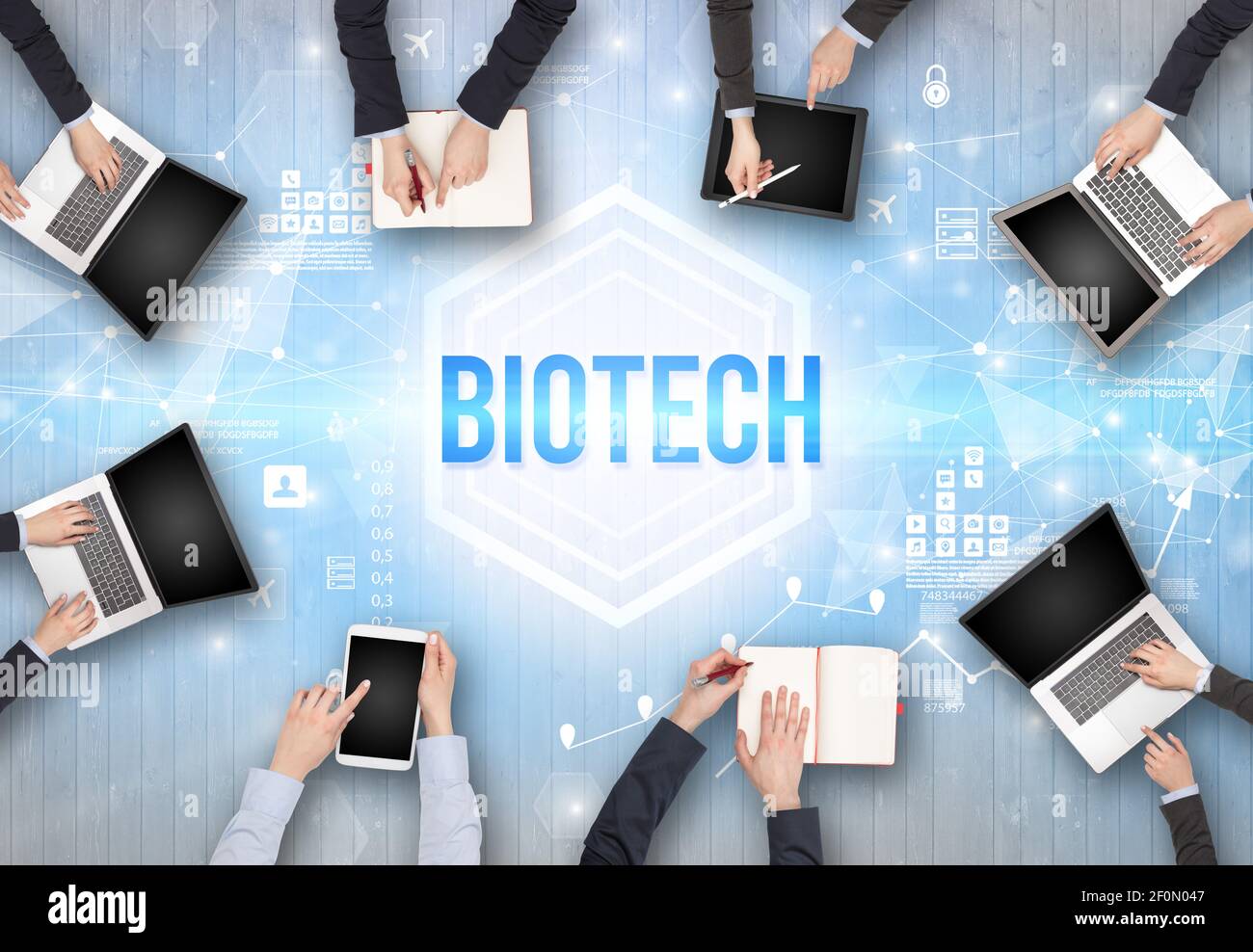 Group of Busy People Working in an Office with BIOTECH inscription ...