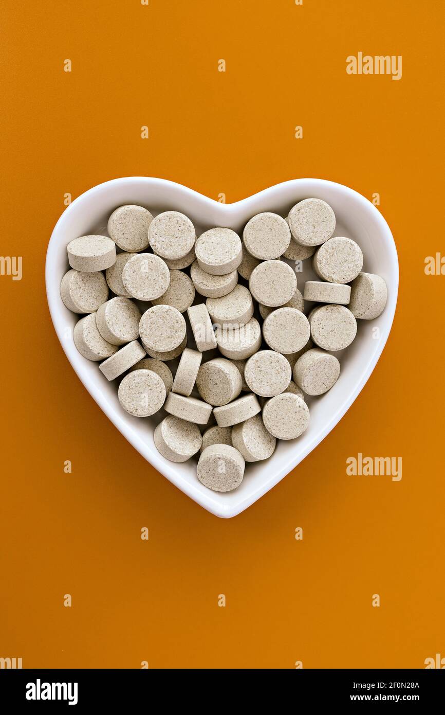 closeup of DGL (licorice root extract) chewable tablets. dietary