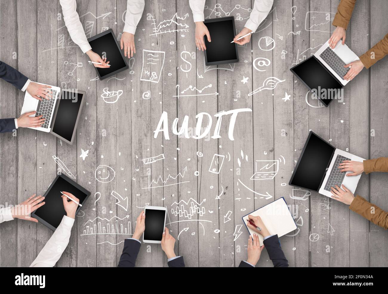 Group of business people working in office with AUDIT inscription ...