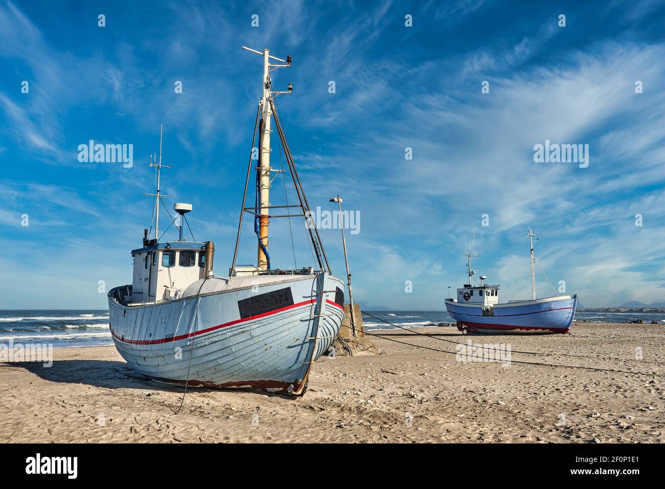 Coastal fishing boats vessels at Vorupoer beach in Western Denmark
