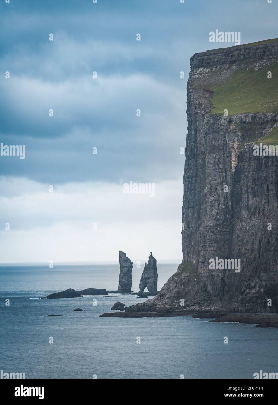 Risin and Kellingin rocks in the sea as seen from Tijornuvik bay on Streymoy on the Faroe Islands, Denmark, Europe Stock Photo