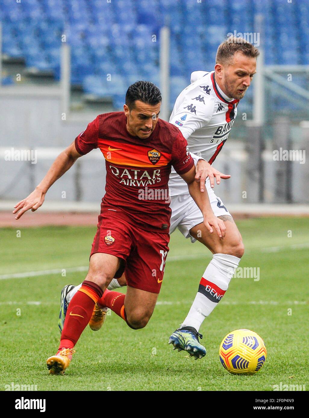 Rome, Italy. 07th Mar, 2021. Roma's Pedro, left, is challenged by Genoa's  Domenico Criscito during the Italian Serie A Football match between Roma  and Genoa at the Olympic stadium. Credit: Riccardo De