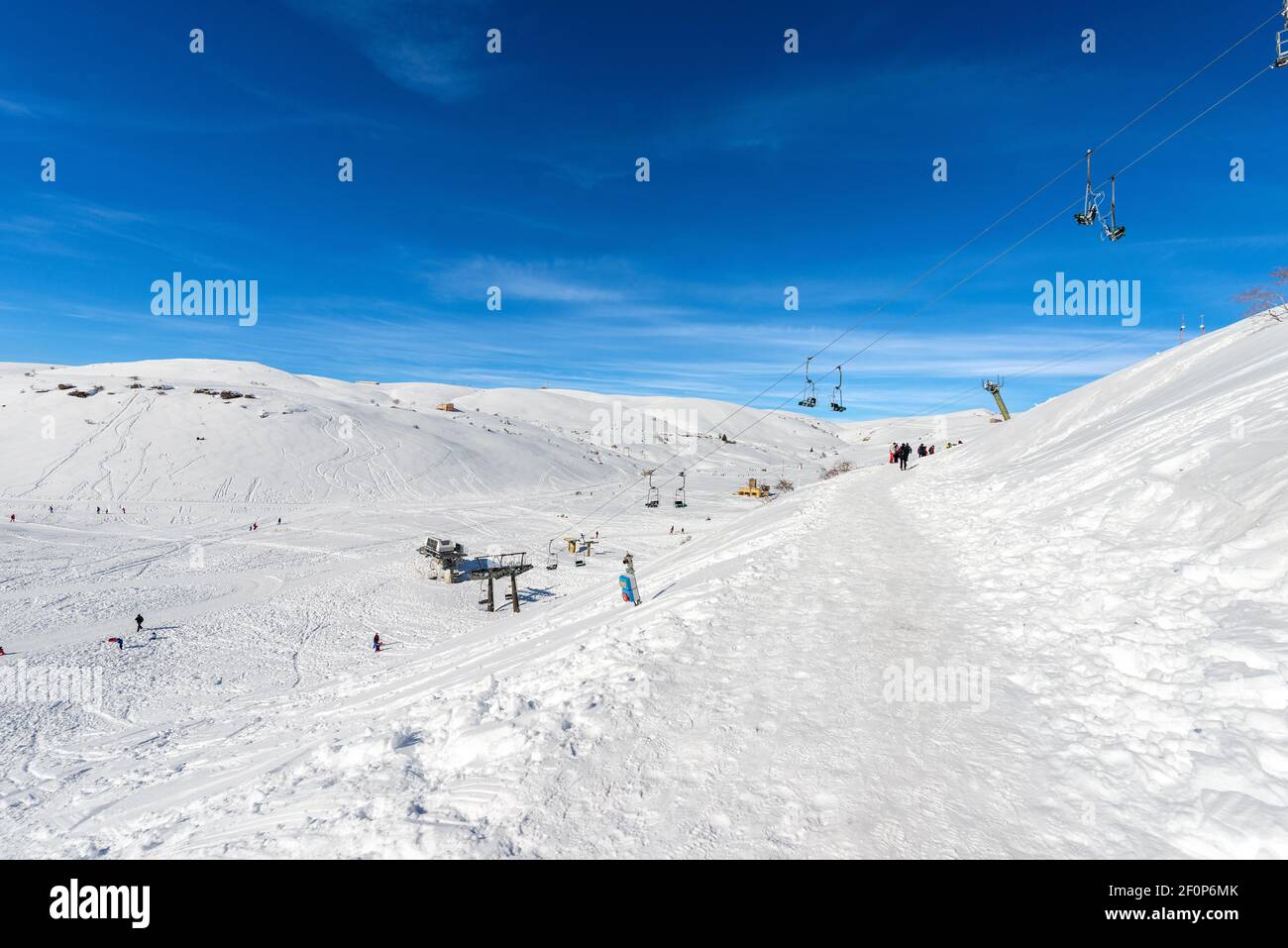 Malga San Giorgio ski resort, lessinia Plateau, Bosco Chiesanuova  municipality, Verona, Veneto, Italy. On background the Italian Alps (Monte  Carega Stock Photo - Alamy