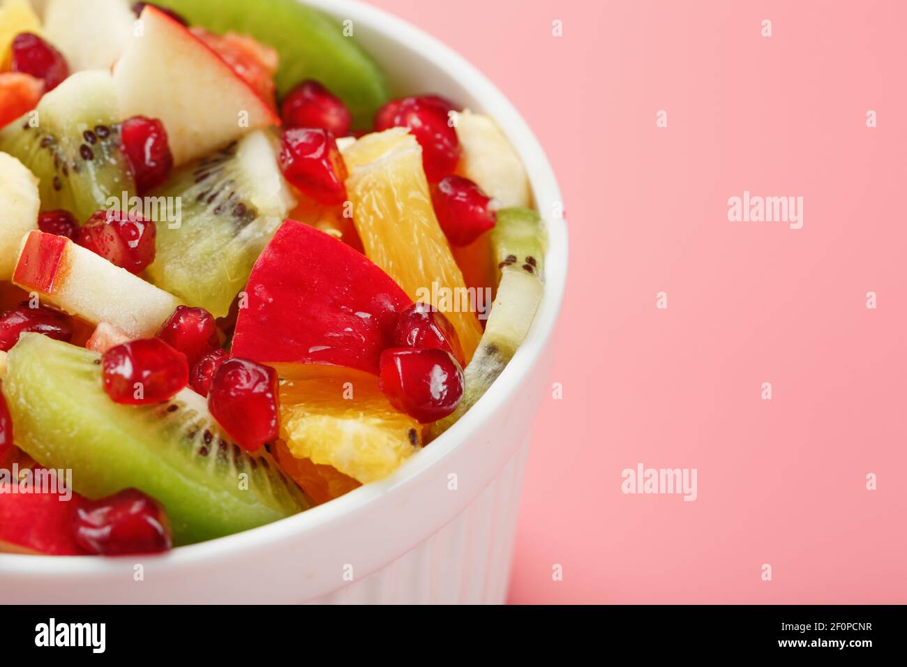 fresh fruit pieces salad in plastic cup Stock Photo by magone